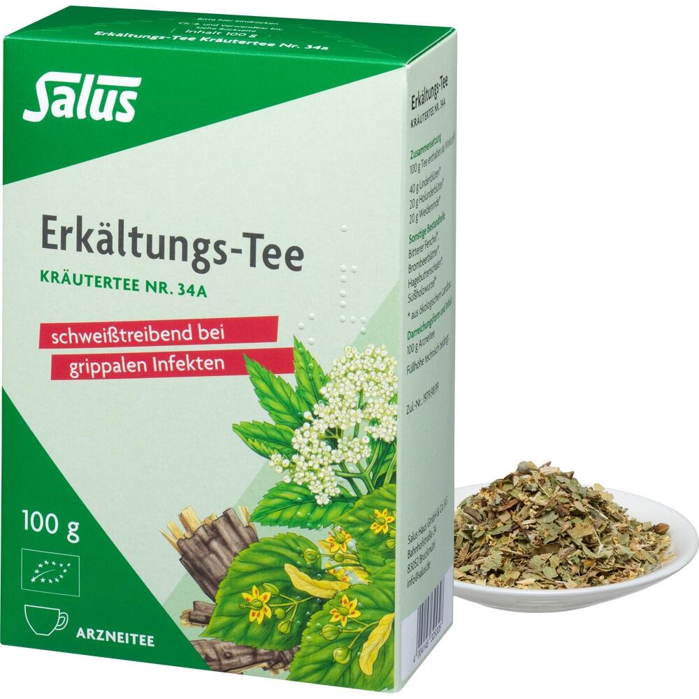 Eine gr&uuml;ne Packung Erk&auml;ltungs-Tee steht neben einem Teller mit Teebl&auml;ttern.