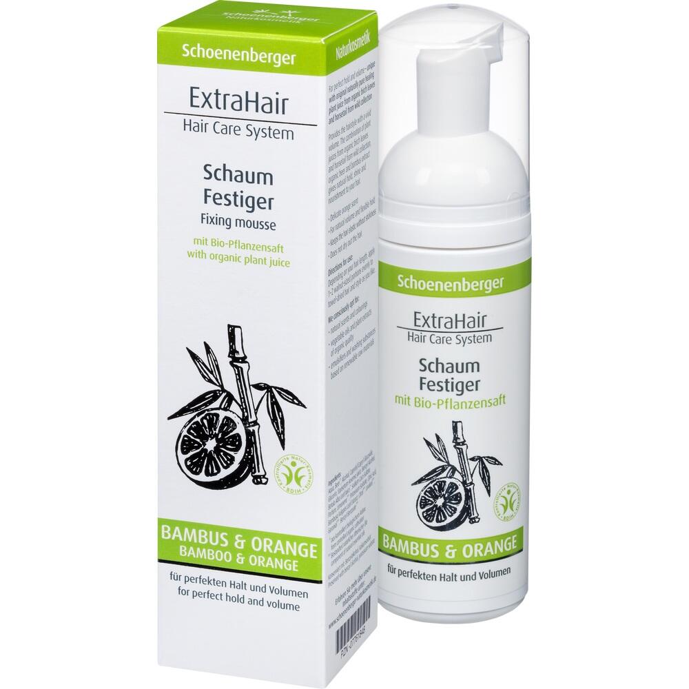 Haarschaum und Verpackung mit Bambus- und Orangendruck stehen nebeneinander.