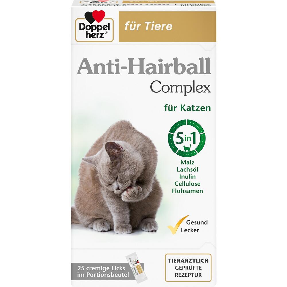 Eine Katze leckt ihre Pfote auf einer Packung Anti-Haarball-Mittel f&uuml;r Katzen.